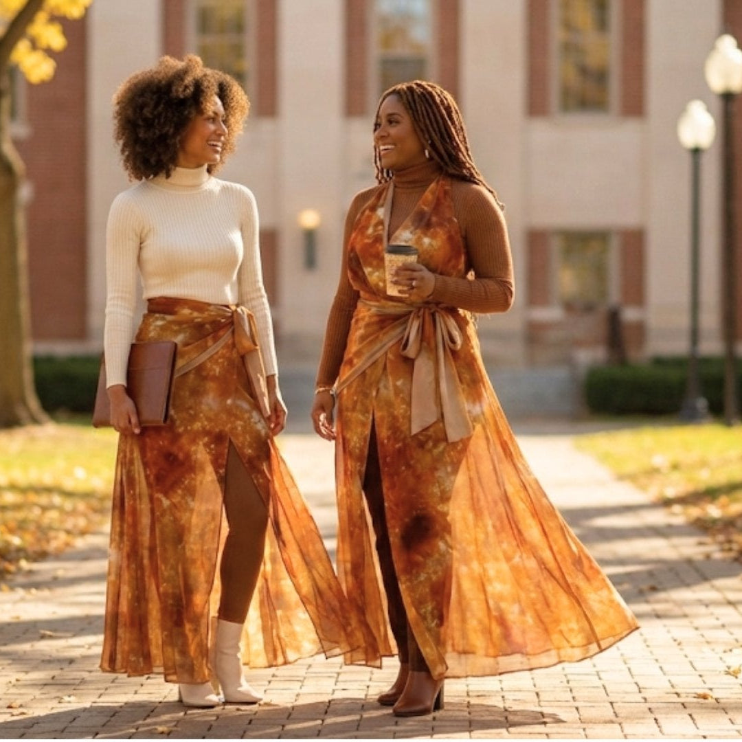 Two women walking on a path with a building in the background