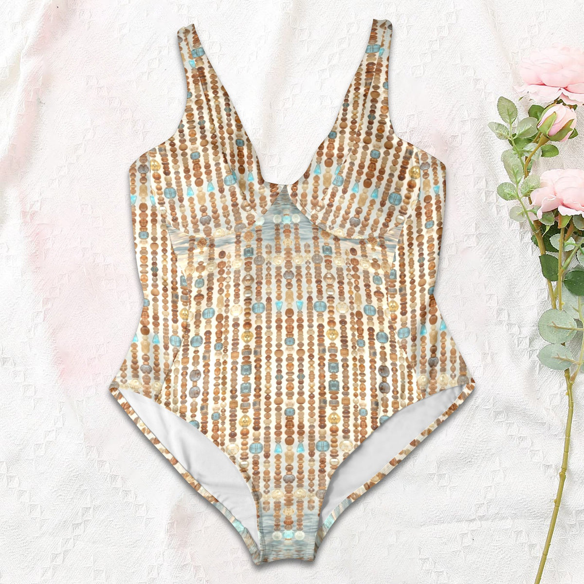 One-piece swimsuit with a Water Goddess pattern on a light background