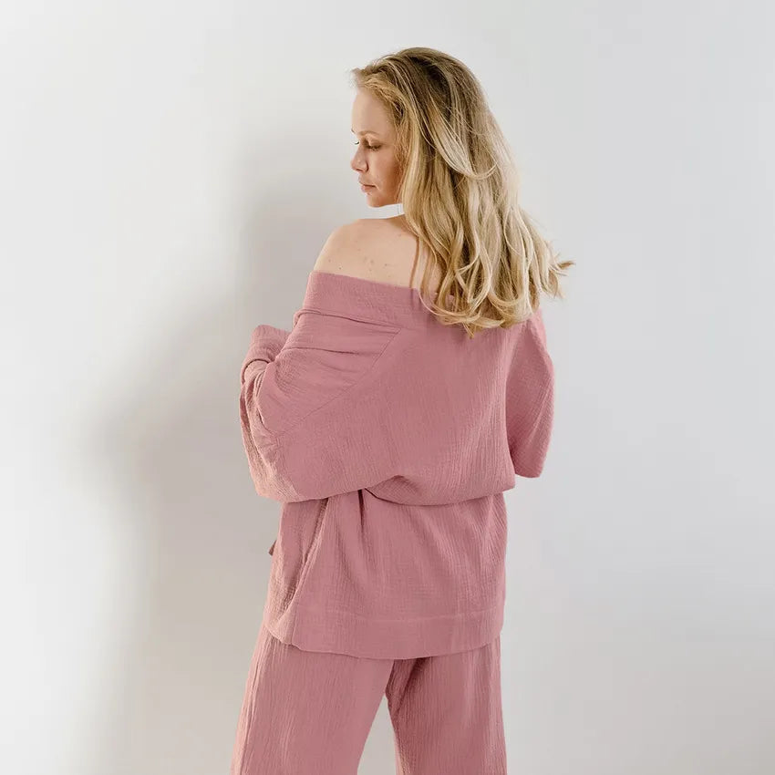 Back view of Model wearing dusty pink Ira Kimono and Pants set. Breathable cotton lounge set with matching open-front kimono robe, waist sash, and full-length relaxed-fit pants. Cozy fashion perfect for sleep, loungewear, or resort wear.