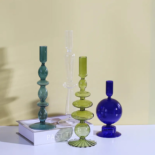 Roma Glass candlestick holders by Shop the Kei home treasure collection in various clear colors; green, blue, teal, and clear. Handmade modern-style colored glass candlestick holder, tall and elegant, perfect for home décor. Available in multiple unique designs