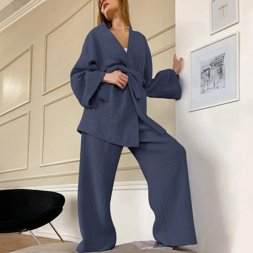Model wearing stormy sky Ira Kimono and Pants set. Breathable cotton lounge set with matching open-front kimono robe, waist sash, and full-length relaxed-fit pants. Cozy fashion perfect for sleep, loungewear, or resort wear.