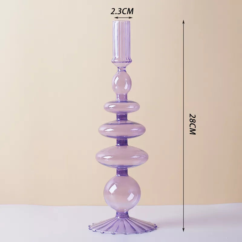 Roma Glass candlestick holder by Shop the Kei home treasure collection in clear purple. Roma Glass candlestick holder by Shop the Kei home treasure collection in clear purple. Stacked 1-drop, 1-saucer, 2-disk, bubble with scalloped slope base modern-style blown glass candlestick holder dimensions 2.5cm X 28cm X 9cm