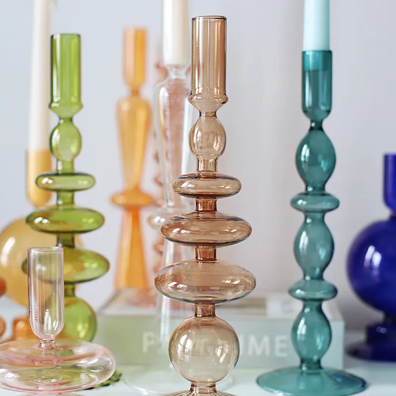 Roma Glass candlestick holders by Shop the Kei home treasure collection in various clear colors; green, blue, brown, and yellow. Handmade modern-style colored glass candlestick holder, tall and elegant, perfect for home décor. Available in multiple unique designs