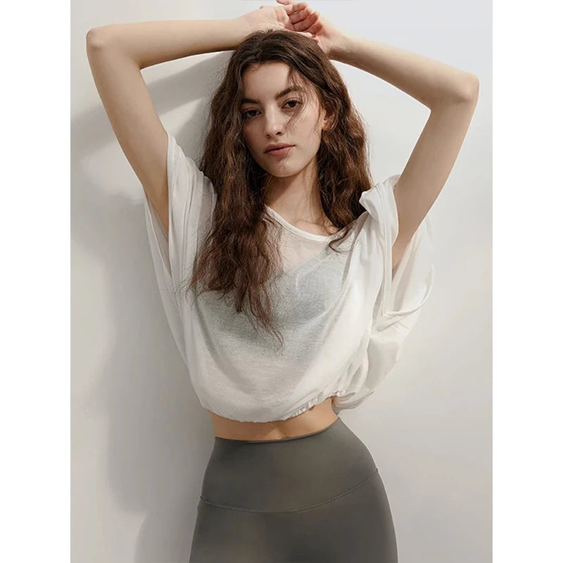 Veda Butterfly Top from Shop the Kei - featuring a loose fitting dancer inspired design that flows and flexes with your workout movements. Elastic waist creates an accentuating shape. Romantic top idea for an active date