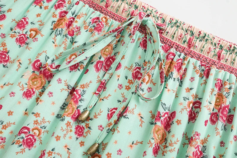 Birdie Summer Midi Skirt from Shop The Kei - mint skirt closeup detail of ivory color stretch waistband, beaded mint waist tie, floral print pattern, and natural fiber textile texture