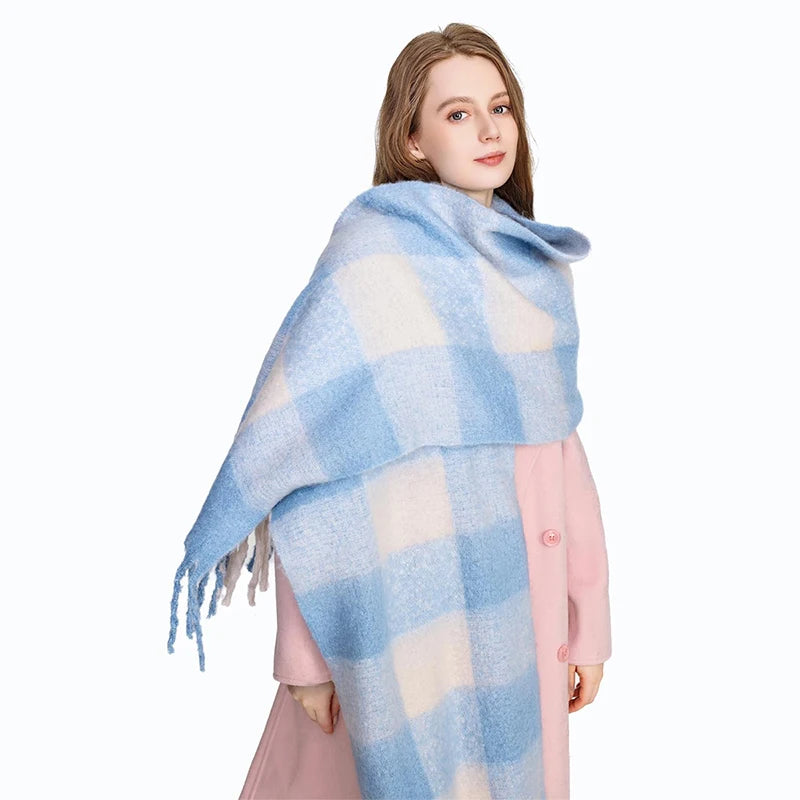 Woman wearing a blue and white scarf with her pink coat