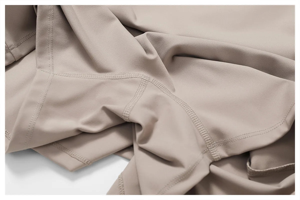 Close view of the Bree Yoga Dress in dark linen color. Highlights the flat seam construction
