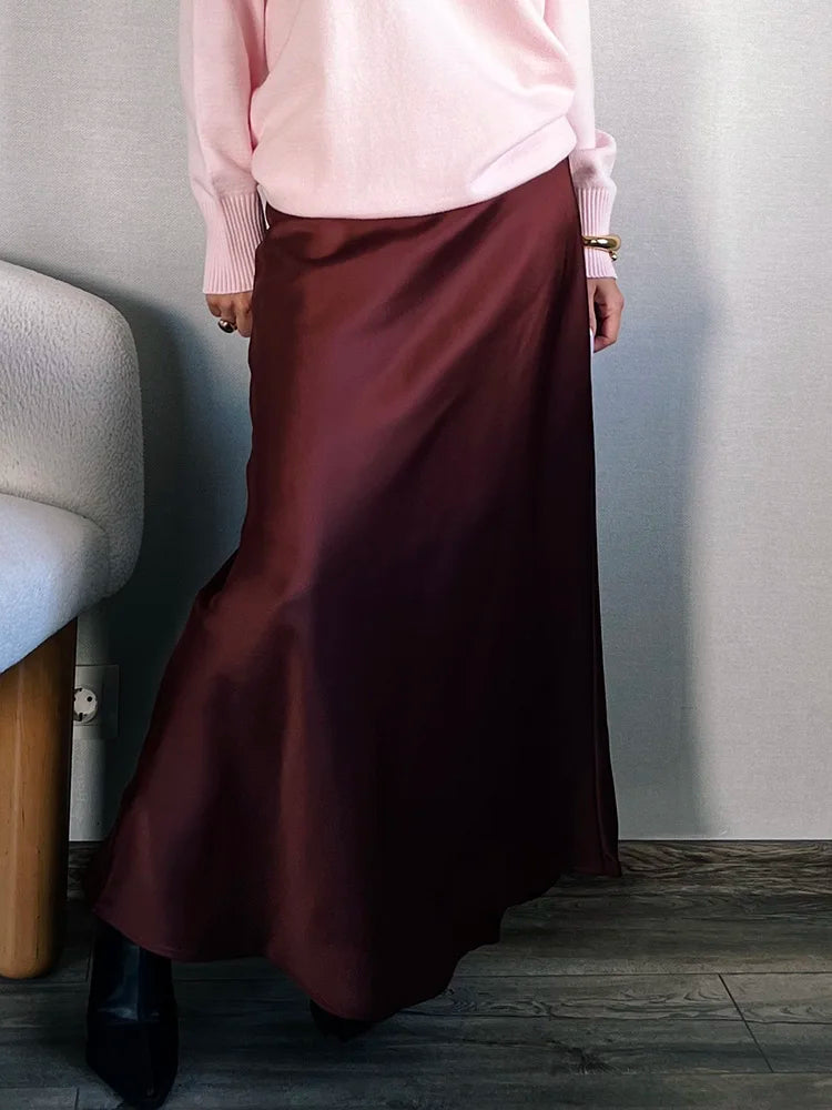Bela Satin Maxi Skirt from Shop the Kei - flowing satin maxi skirt with drawstring waist and flare hem. Pairs well with a pretty sweater