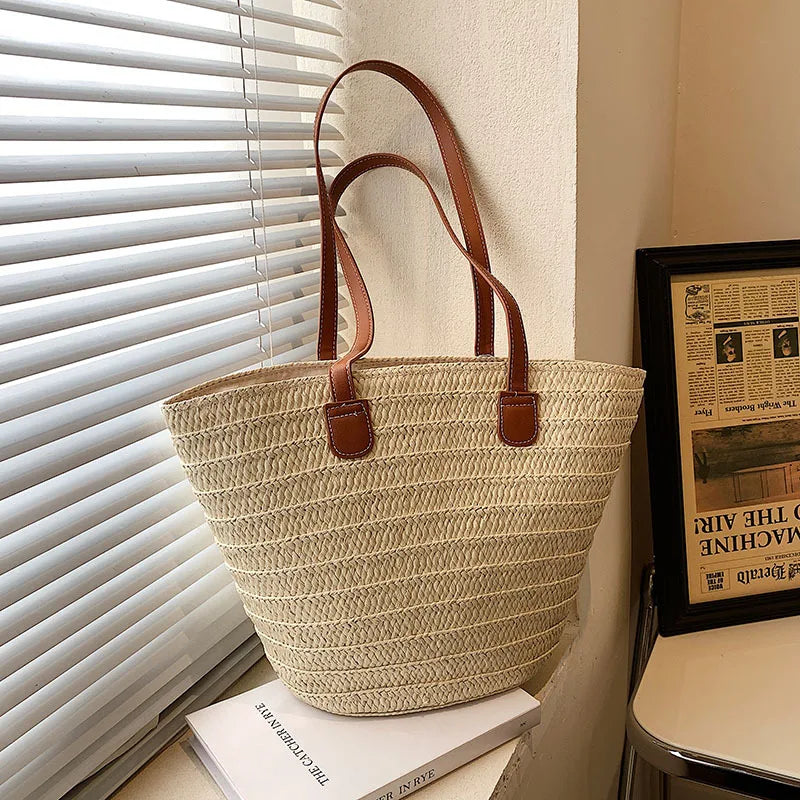 Natural ivory color straw bag with brown faux leather straps