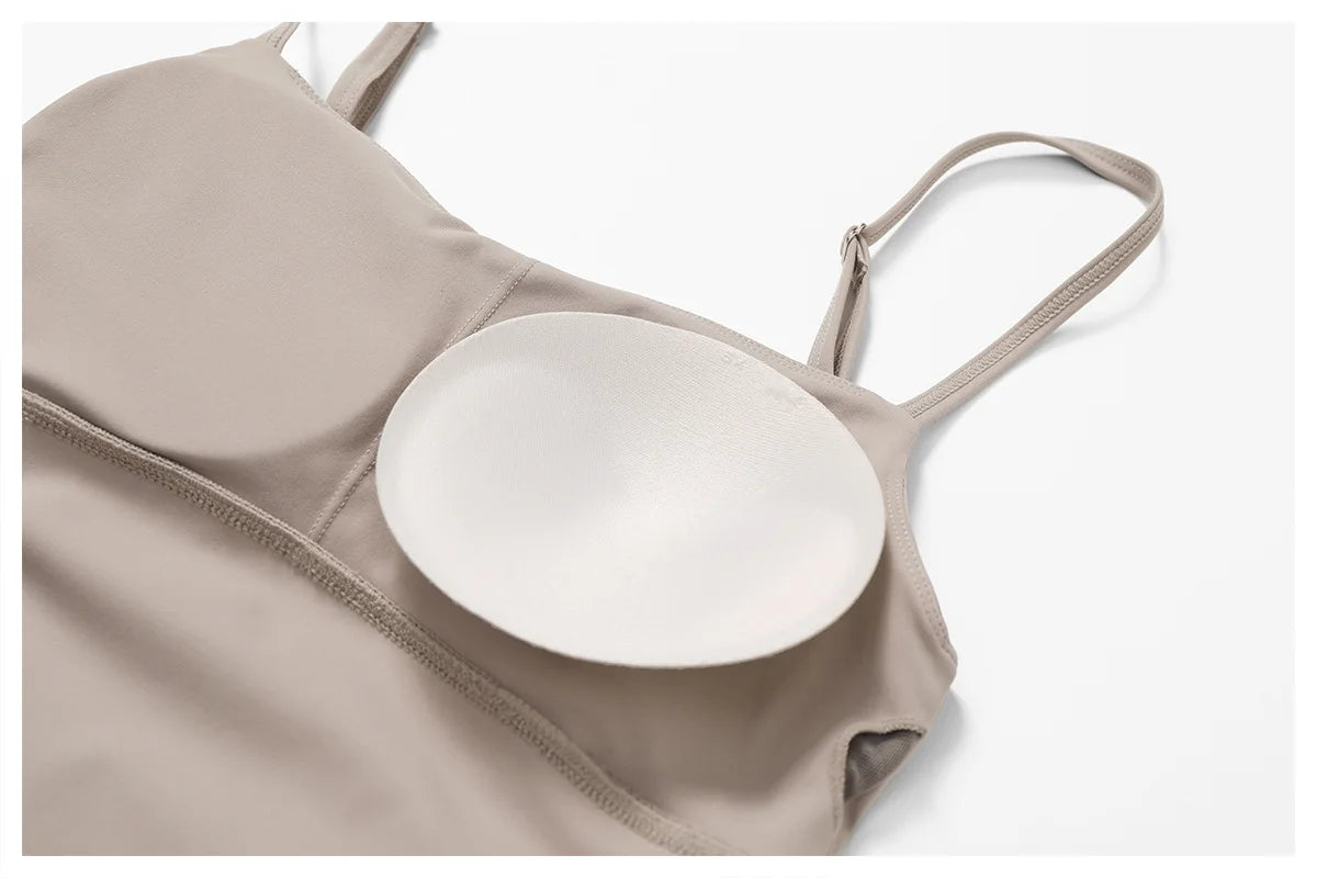 Close view of the Bree Yoga Dress in dark linen color. Highlights the inside bra construction and padding