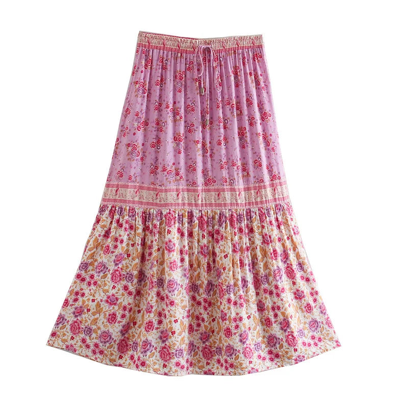 Birdie Summer Midi Skirt from Shop The Kei - pink floral skirt with ivory border prints features pink and purple flower pattern displayed on plain white background.