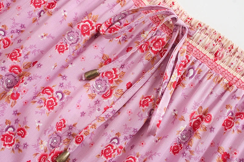 Birdie Summer Midi Skirt from Shop The Kei - pink skirt closeup detail of ivory color stretch waistband, pink beaded waist tie, floral print pattern, and natural fiber textile texture