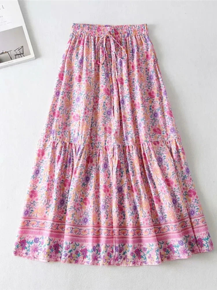 Amelie Boho Maxi Skirt from Shop The Kei - front view - pink floral skirt featuring pink, yellow, and purple flower pattern, displayed on plain white background.