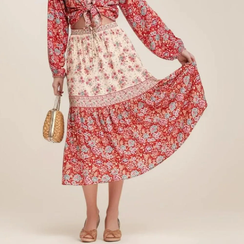 Birdie Summer Midi Skirt from Shop The Kei - flowing red and ivory floral midi skirt with decorative border print elastic waistband and floral print ruffled hem, made of natural fibers. Pairs well with red tops and straw bags
