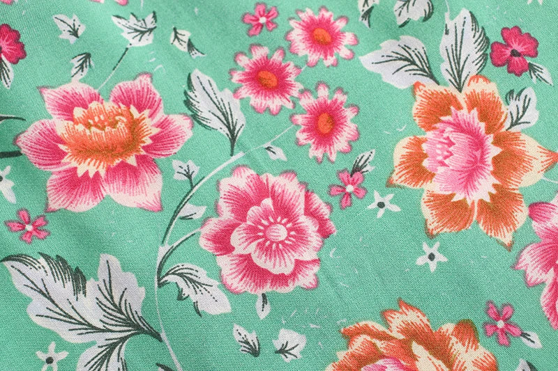 Birdie Summer Midi Skirt from Shop The Kei - mint skirt closeup detail of pink and orange floral print pattern and natural fiber textile texture