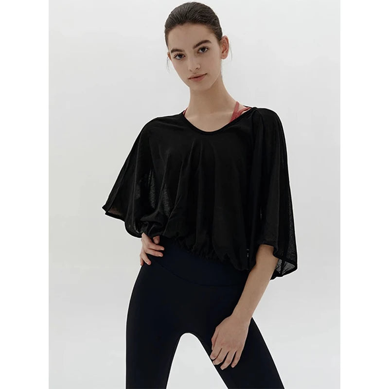 Veda Butterfly Top from Shop the Kei - black color option loose fitting dancer inspired design that drapes elegantly over the shoulders. Elastic waist creates an accentuating shape.
