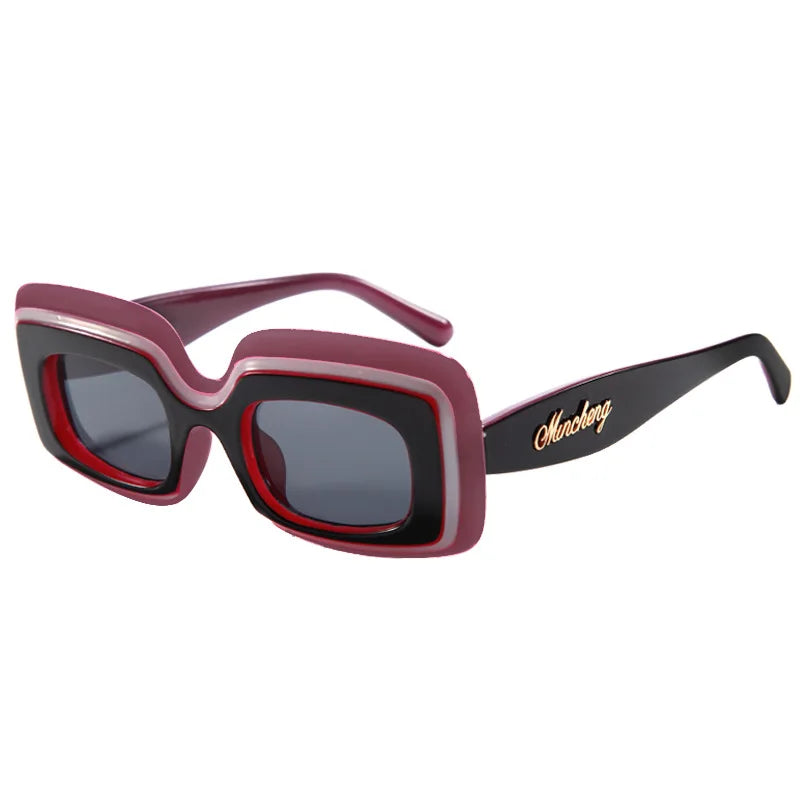 Orchid Retro Shades sunglasses, a mauve-pink frame with a red inner rim and black temple arms, shown at a three-quarter angle on a white background.