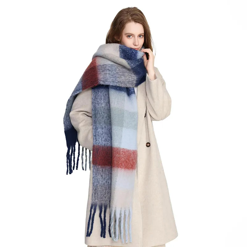 Woman wearing a blue and gray scarf with her coat