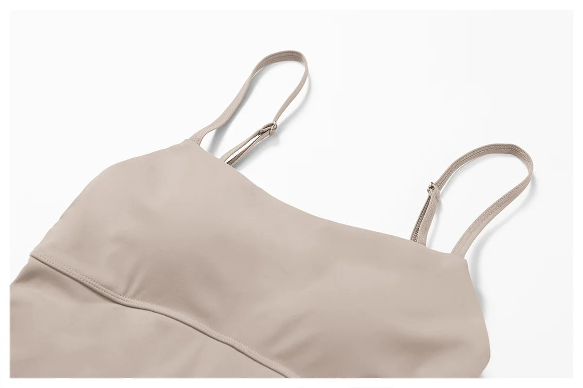 Close view of the Bree Yoga Dress in dark linen color. Highlights thin adjustable spaghetti straps, straight neckline, fitted bodice, and topstitching under bust