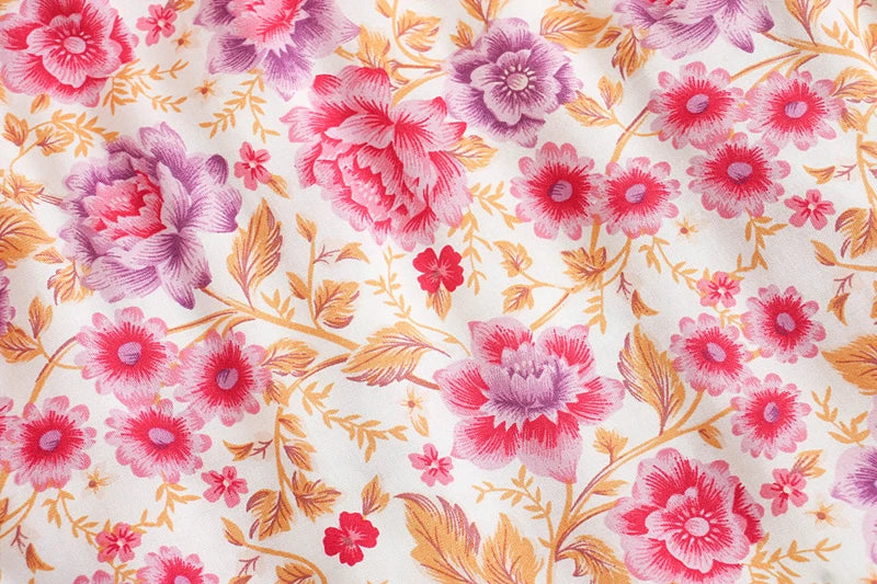 Birdie Summer Midi Skirt from Shop The Kei - pink skirt closeup detail of pink and purple floral print pattern on ivory background