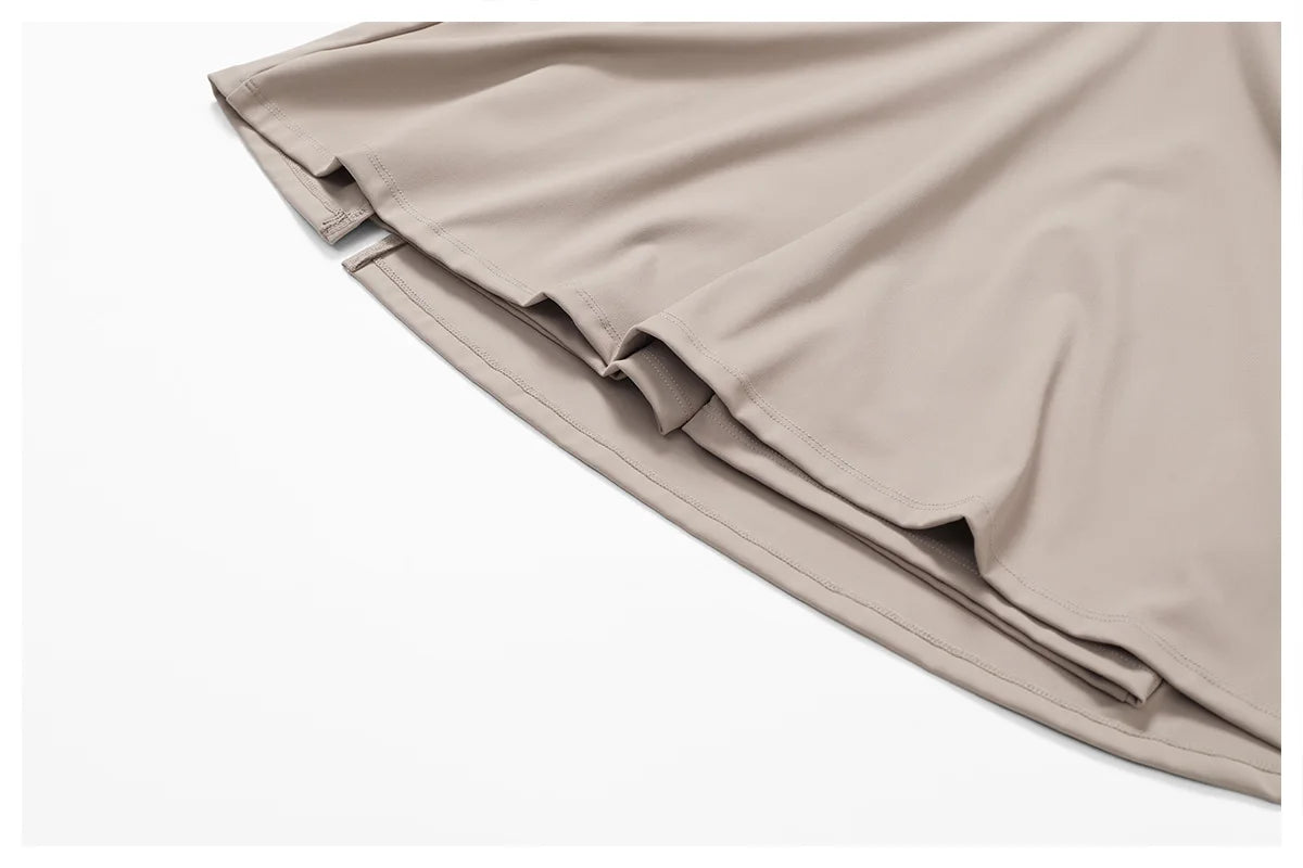 Close view of the Bree Yoga Dress in dark linen color. Highlights the smooth, light knit fabric texture