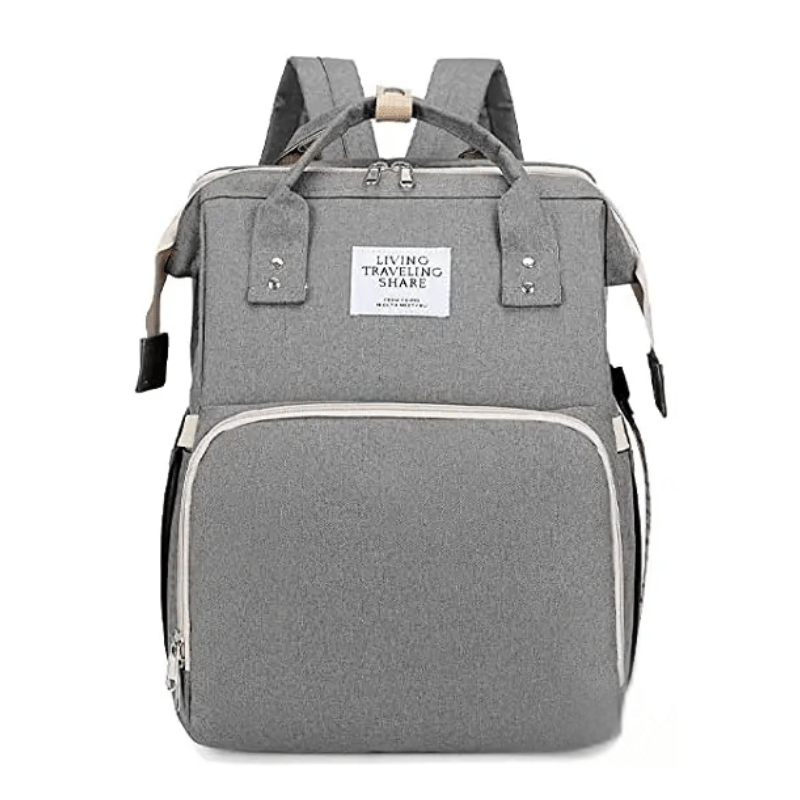Gray Lotus 3-in-1 Bassinet Diaper Bag with cream trim zippers, wide backpack straps, and multiple compartments for baby essentials. Partial canopy available