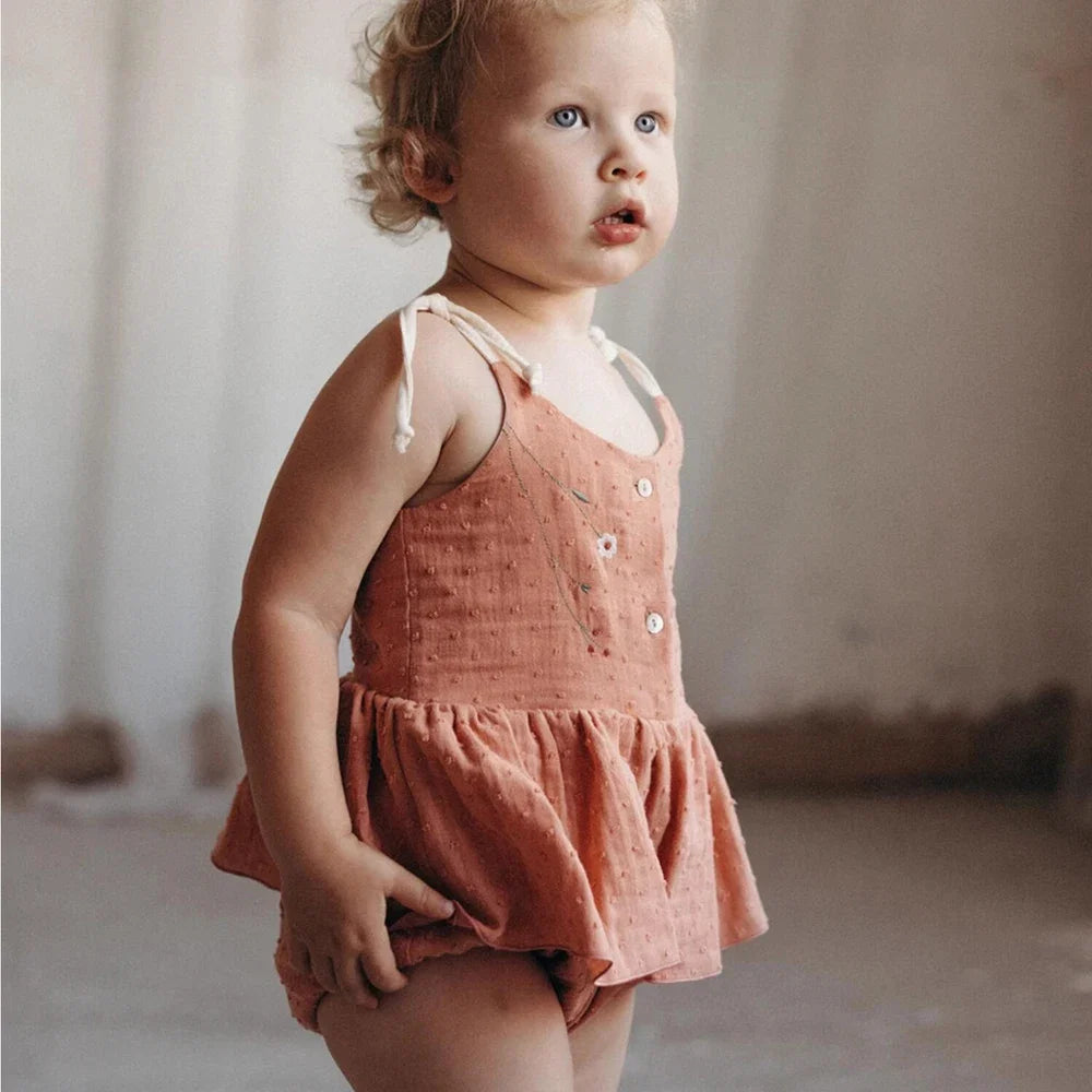 Wildflower Romper, one of the two anchor pieces from our one-bag experiment