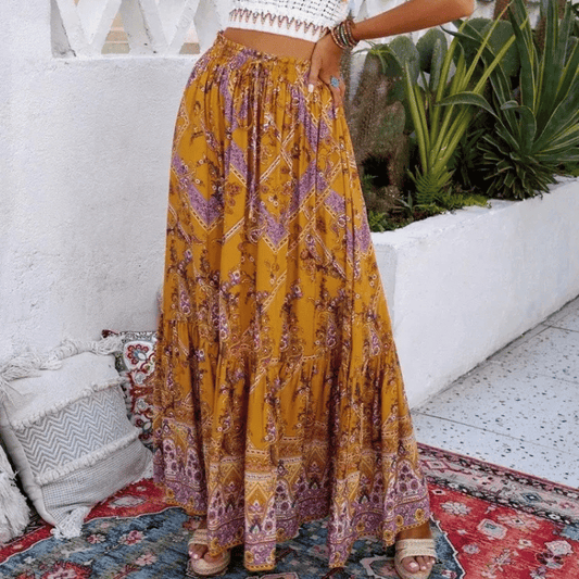 Paris Boho Maxi Skirt from Shop The Kei - flowing golden yellow and purple floral maxi skirt with elastic waistband and ruffled hem, made of natural fibers. Pairs well with crochet tops and tan sandals