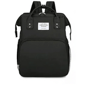 Black Lotus 3-in-1 Bassinet Diaper Bag with cream trim zippers, wide backpack straps, and multiple compartments for baby essentials. Partial canopy available