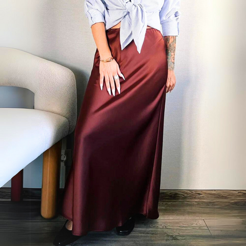 Bela Satin Maxi Skirt from Shop the Kei - flowing satin maxi skirt with drawstring waist and flare hem. Pairs well with neutral colors. Completes a professional look with a collared skirt