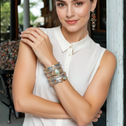 Woman wearing multiple bracelets in an outdoor setting