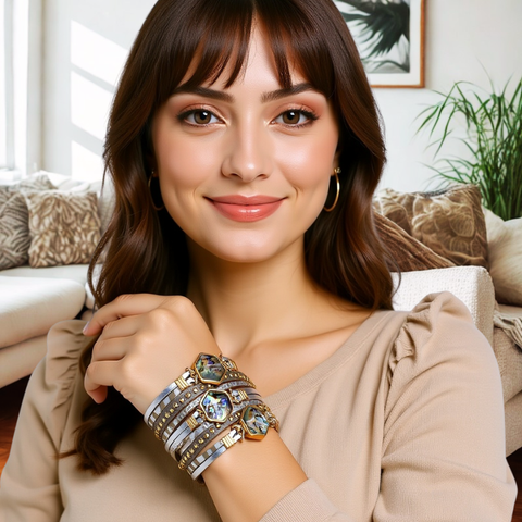 Woman wearing multiple bracelets in a living room setting