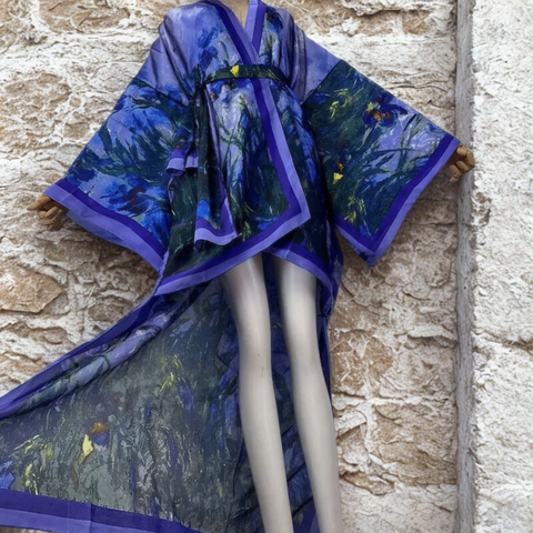 Blue and green patterned kimono on a mannequin against a stone wall.