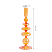 Roma Glass candlestick holder by Shop the Kei home treasure collection in clear orange. Roma Glass candlestick holder by Shop the Kei home treasure collection in clear orange. Stacked 1-drop, 1-saucer, 2-disk, bubble with scalloped slope base modern-style blown glass candlestick holder dimensions 2.5cm X 28cm X 9cm