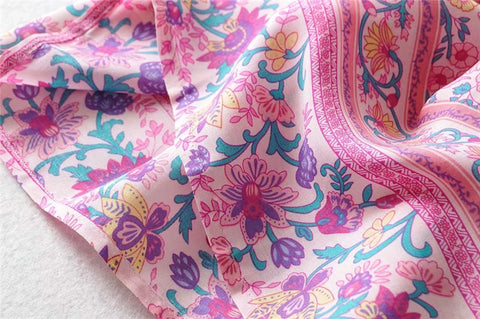 Amelie Boho Maxi Skirt from Shop The Kei - closeup detail of hemline, decorative borders and floral print pattern, and natural fiber textile texture