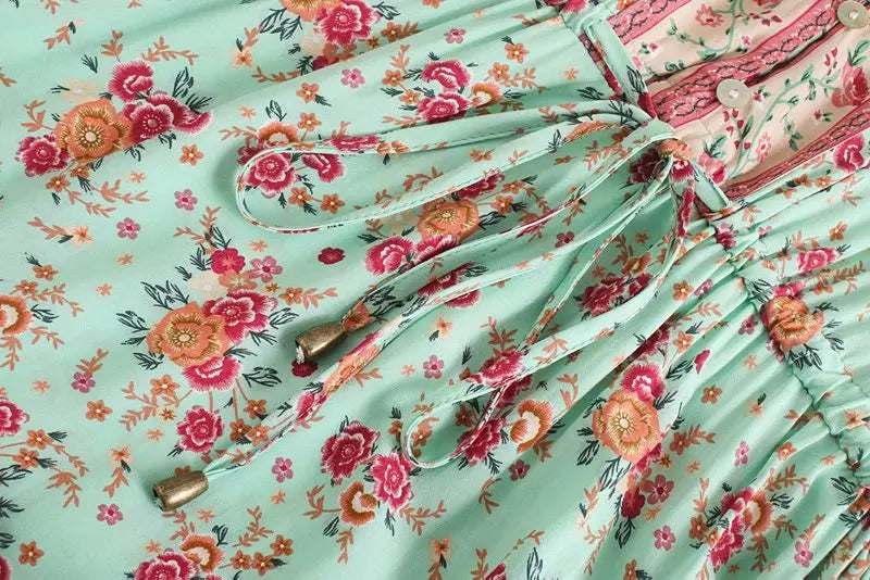 Birdie Summer Midi Dress from Shop the Kei - close up of mint flower print v neck button closure, beaded waist tie, and soft natural textile and texture