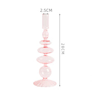 Roma Glass candlestick holder by Shop the Kei home treasure collection in clear pink. Roma Glass candlestick holder by Shop the Kei home treasure collection in clear pink. Stacked 1-drop, 1-saucer, 2-disk, bubble with scalloped slope base modern-style blown glass candlestick holder dimensions 2.5cm X 28cm X 9cm