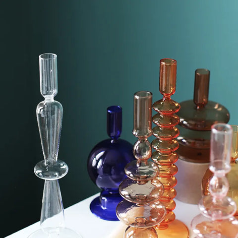 Roma Glass candlestick holders by Shop the Kei home treasure collection in various clear colors; orange, blue, brown, and pink. Handmade modern-style colored glass candlestick holder, tall and elegant, perfect for home décor. Available in multiple unique designs 