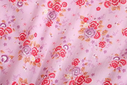 Birdie Summer Midi Dress from Shop the Kei - close up of pink purple flower print pinks and oranges and soft natural textile