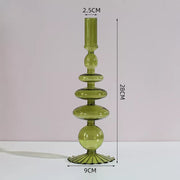 Roma Glass candlestick holder by Shop the Kei home treasure collection in clear orange. Roma Glass candlestick holder by Shop the Kei home treasure collection in clear green. Stacked 1-drop, 1-saucer, 2-disk, bubble with scalloped slope base modern-style blown glass candlestick holder dimensions 2.5cm X 28cm X 9cm