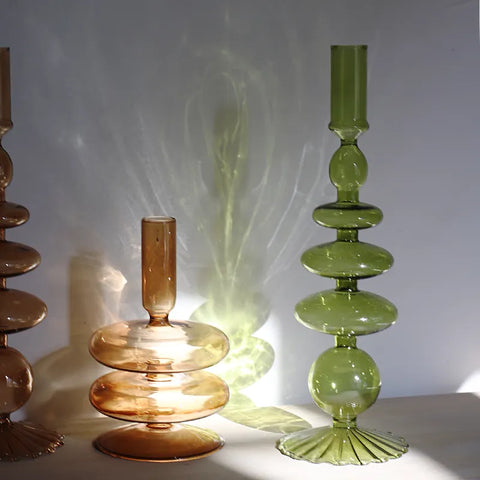 Roma Glass candlestick holders by Shop the Kei home treasure collection in various clear brown and green shapes. Handmade modern-style colored glass candlestick holder, tall and elegant, perfect for home décor. Available in multiple unique designs 