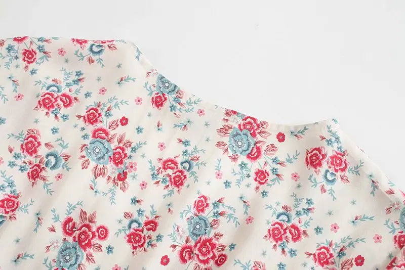 Birdie Summer Midi Dress from Shop the Kei - close up back neckline, flower print reds, pinks, and blues in soft natural textile