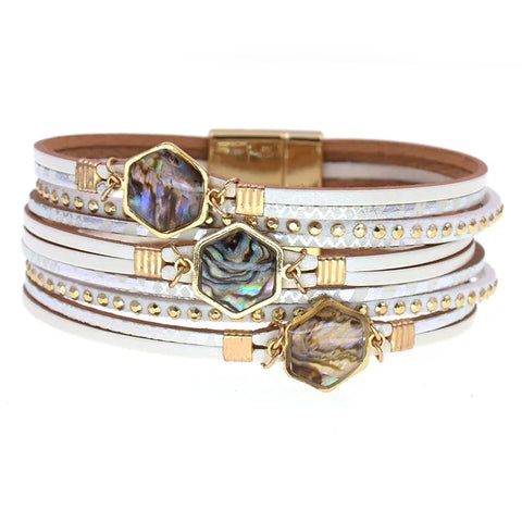Multi-layered bracelet with gold accents and gemstone-like charms on a white background