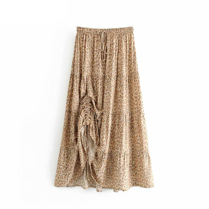 Nirabi Leopard Maxi Skirt from Shop the Kei - front view - animal print maxi skirt with elastic waistband and asymmetric hem displayed on plain white background.