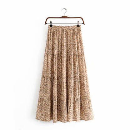 Nirabi Leopard Maxi Skirt from Shop the Kei - back view - animal print maxi skirt with elastic waistband and asymmetric hem displayed on plain white background.