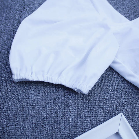 White Lylah Bikini from ShoptheKei.com.  Close up view of the puffy short sleeve gathering construction and smooth white fabrication