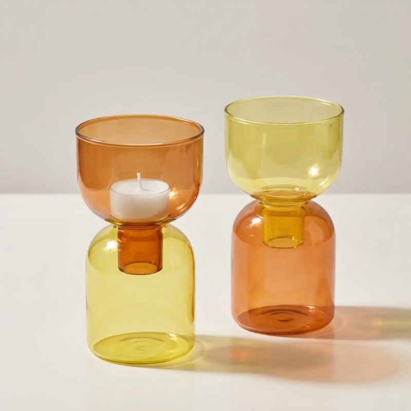 Brown and Yellow Pilla Candle Holders stacked two ways, one holding a lit tealight, styled together on a warm cream surface.