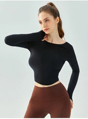 Eden Seamless Cross Back Top from Shop the Kei - side view of athletic apparel soft and breathable long sleeve top. Dancer inspired style pairs well with yoga pants