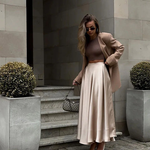 Amber Satin Maxi Skirt from Shop the Kei - flowing satin maxi skirt with high waist and flare hem. Pairs well with neutral colors. Old money luxury style long skirt.