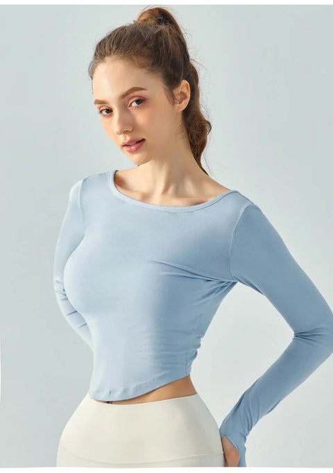 Eden Seamless Cross Back Top from Shop the Kei - side view of athletic apparel soft and breathable long sleeve top. Dancer inspired style pairs well with yoga pants